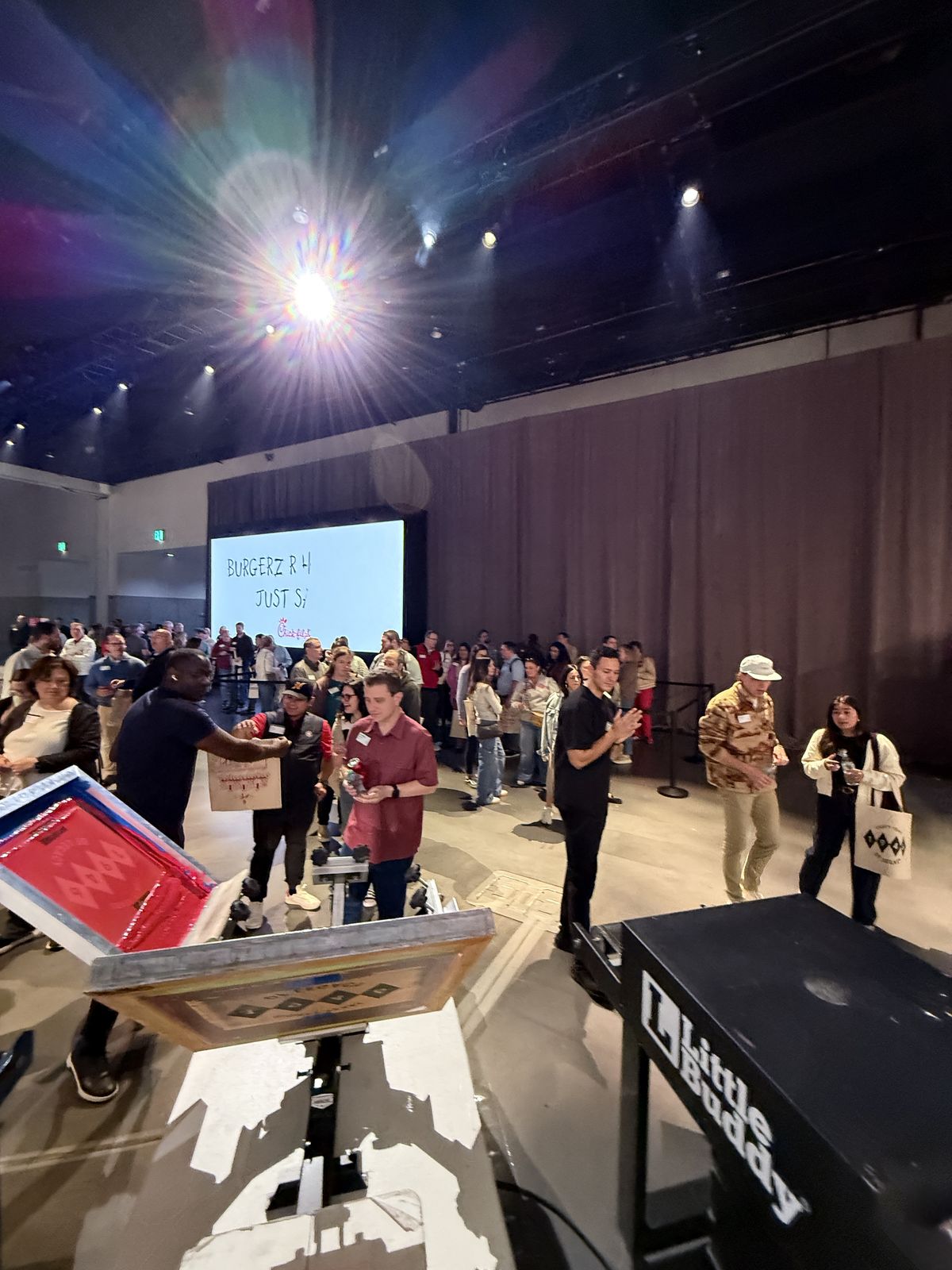 Merch Troop live printing — presses rolling at the event